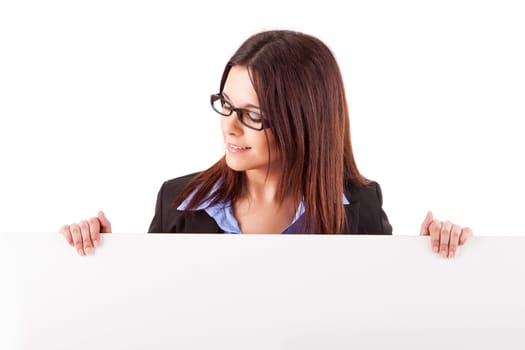Beautiful young woman holding a white card - isolated over white