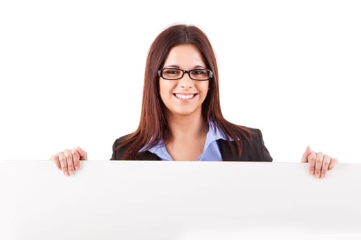 Beautiful young woman holding a white card - isolated over white