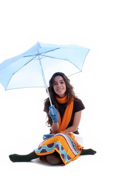 Young woman under an umbrella, posing over white