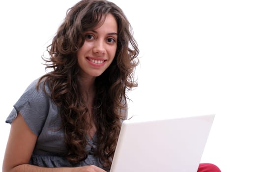Young beautiful girl working with laptop, isolated over white