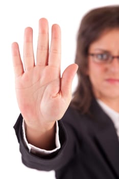 Business woman making stop sign - selective focus on hand