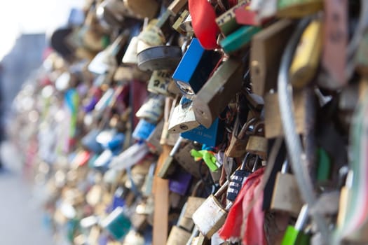 Many Love locks on the bridge in Paris - a symbol of eternal love, friendship and romance. France.