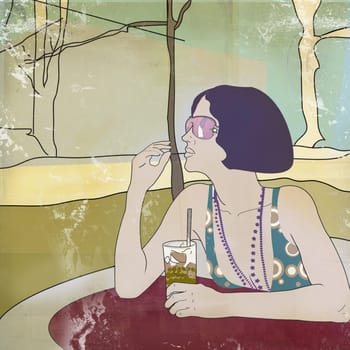 Young woman sitting at the table and holding a glass