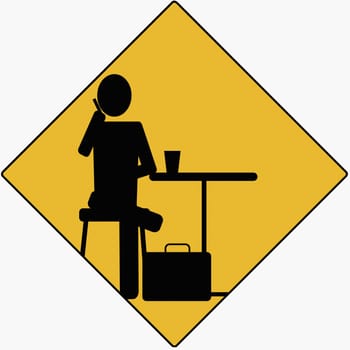 Businessman sitting on a stool and using a mobile phone