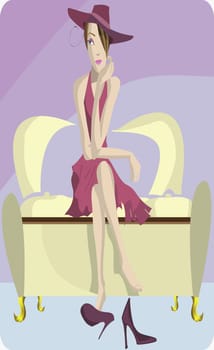 Woman sitting in an armchair with her legs crossed