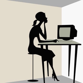 Woman sitting in front of a computer monitor
