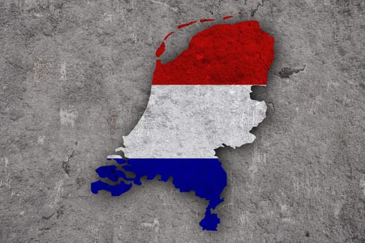 Map and flag of Netherlands on weathered concrete