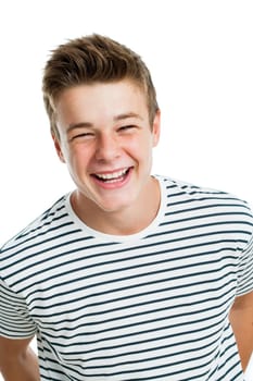 Studio portrait of Handsome teen laughing.Isolated on white background.