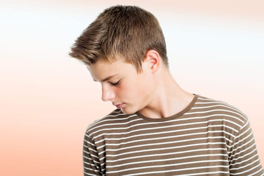 Close up portrait of Teen boy practising concentration exercise with eyes closed.