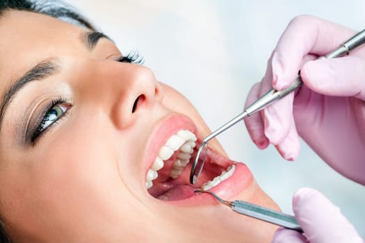 Macro close up of woman having dental check up in clinic.