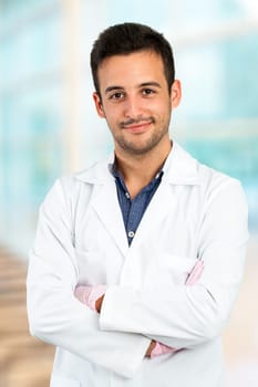 Close up portrait of Young male doctor in dressing gown.
