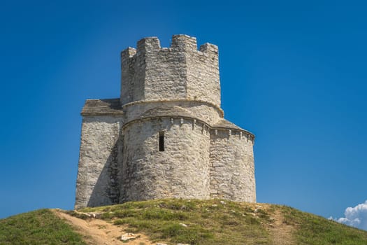 Closeup on small tower like, 11th century, St. Nicholas church situated on small hill, located between Nin and Zaton in Croatia