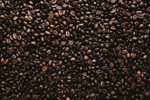 Background with array of dry coffee beans. High quality photo