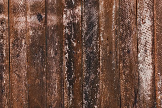 Brown old wooden fence background. Old boards texture. High quality photo