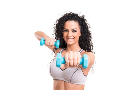 A beautiful young woman exercising - fitness concept