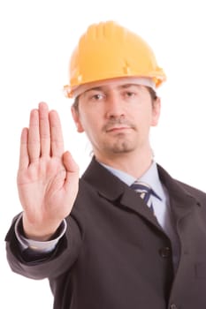 Engineer with yellow hat making stop sign - focus on hand