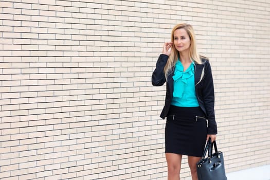 A young and professional business woman outdoors