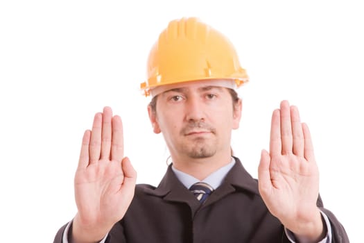 Engineer with yellow hat making stop sign - focus on hands