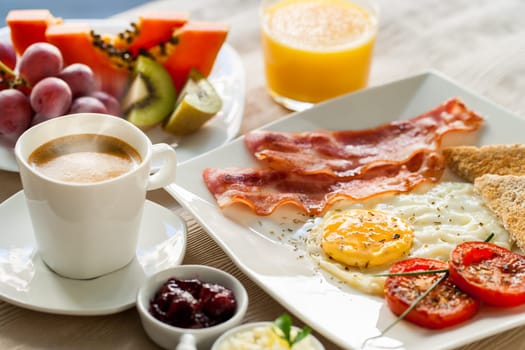 Close up of healthy continental breakfast with fresh fruit and ground coffee.
