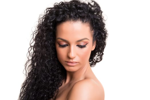Beautiful woman with perfect skin posing over white