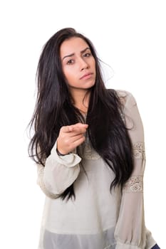 Young beautiful woman pointing at you, isolated over white
