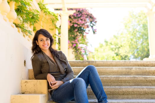 Beautiful young woman relaxing at the park