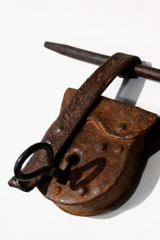 Close_up of a rusty lock with a key