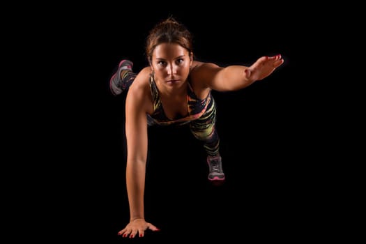 A beautiful young woman exercising - fitness concept