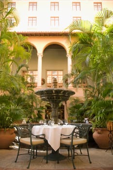 Chairs and a table in front of a hotel, Biltmore Hotel, Coral Gables, Florida, USA