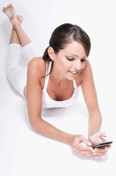 Woman text messaging on a mobile phone