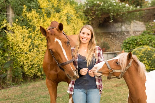 Beautiful and natural young woman spending sometime with her horse