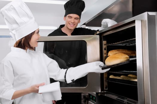 Chefs preparing food in the kitchen