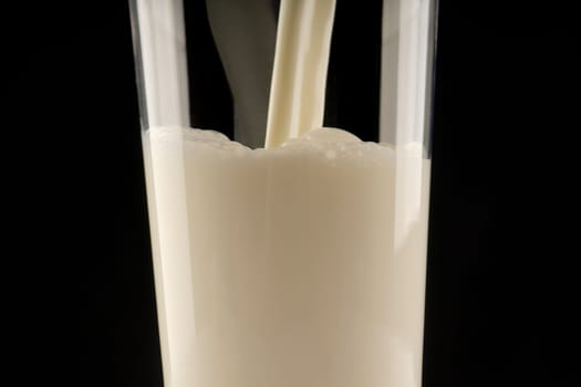 Milk being poured in a glass