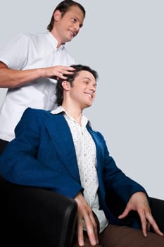 Barber massaging a manŽs head