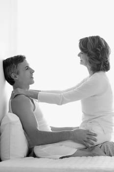 Couple romancing in the bedroom