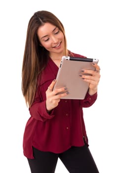 Beautiful woman relaxing with a tablet computer