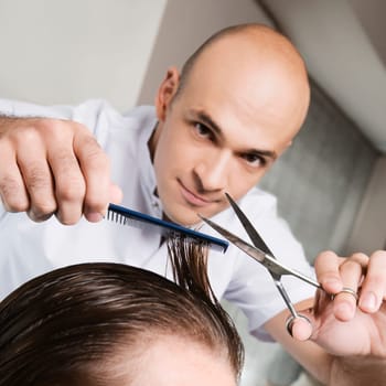 Man receiving a haircut in a salon
