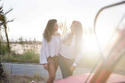 Two friends going on a roadtrip through countryside