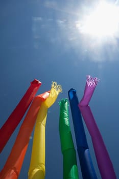 Low angle view of rainbow colored air dancers, Washington DC, USA