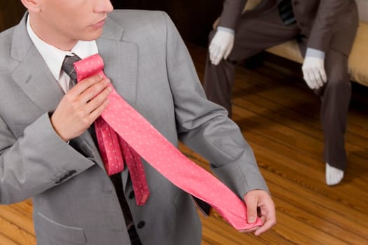 Businessman selecting a tie in a clothing store