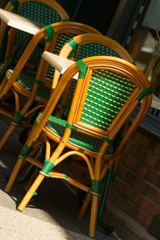 Tables and chairs at a sidewalk cafe