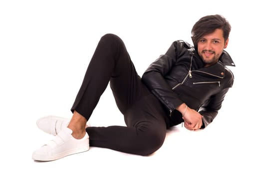 Studio picture of a young and handsome man posing isolated