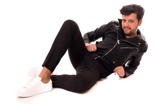 Studio picture of a young and handsome man posing isolated