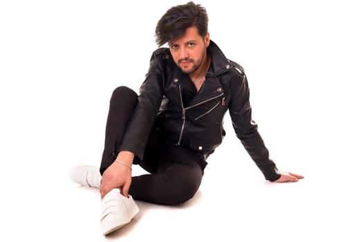Studio picture of a young and handsome man posing isolated