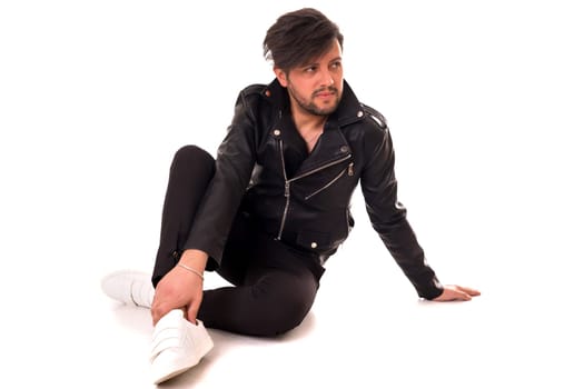 Studio picture of a young and handsome man posing isolated