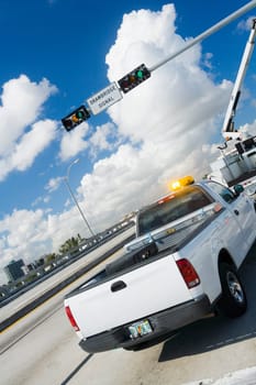 Pick_up truck and a mobile crane on a drawbridge