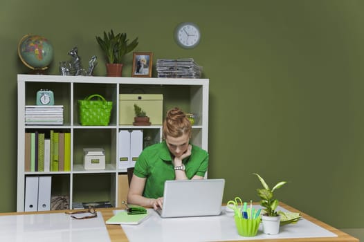 Businesswoman working on a laptop in the office