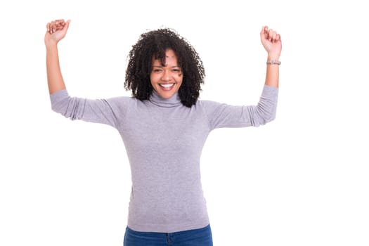 Studio shot of a Very Happy african woman with arms raised