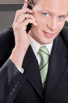 Close_up of a businessman talking on a mobile phone