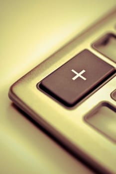 Close_up of add button on a calculator